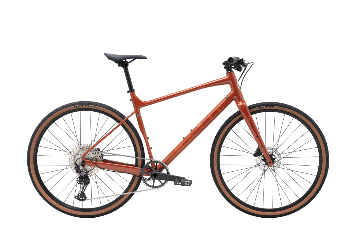 2026 Marin DSX 2 in clay orange, flat-bar gravel bicycle, side profile